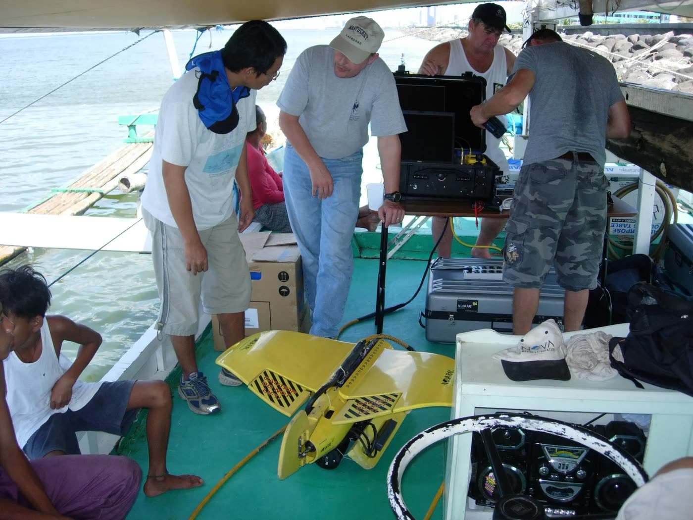 Crew setting up the topside console and the platform on deck